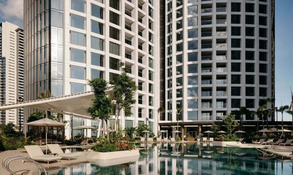 Artist’s rendering of a luxury high-rise residential tower rising above a green urban landscape