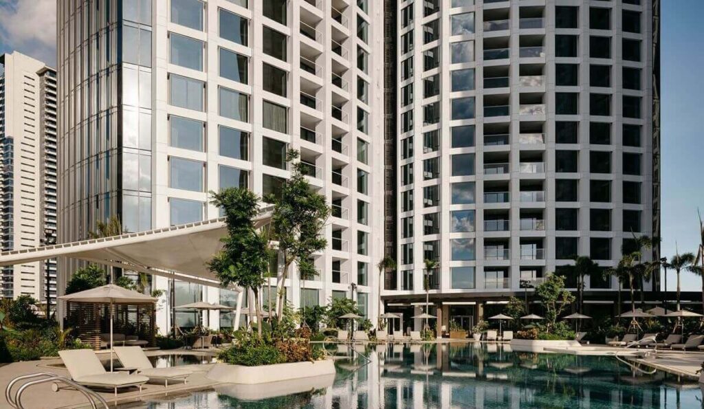 Artist’s rendering of a luxury high-rise residential tower rising above a green urban landscape