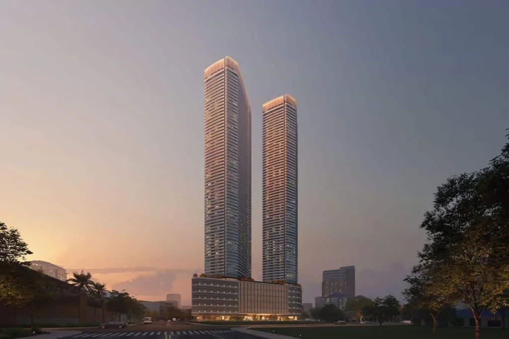 Twin luxury residential towers at sunset representing Shang Properties’ proven track record in premium urban development