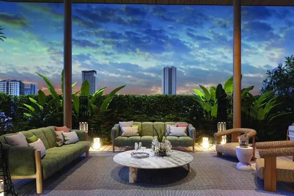 Luxury outdoor condominium lounge with comfortable seating, landscaped greenery, and city views at dusk
