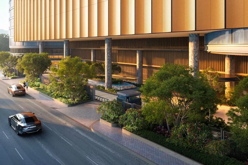 Luxury residential development along a landscaped urban street, highlighting accessibility, exclusivity, and a prime city location