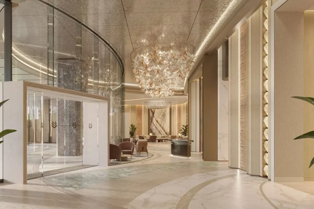 Elegant Shang Bauhinia Residences lobby with refined marble finishes, sculptural lighting, and sophisticated lounge areas